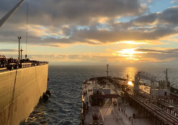 Huge ships next to each other in the ocean Two huge ships next to each other in the ocean
